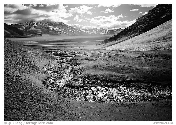 Stream flows from the hills into the floor of the Valley of Ten Thousand smokes. Katmai National Park (black and white)