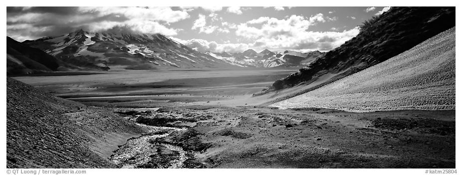 Stream flowing into arid ash-covered valley. Katmai National Park (black and white)