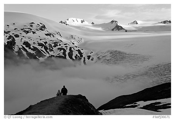 Two people hiking down Harding Ice Field trail. Kenai Fjords National Park, Alaska, USA.