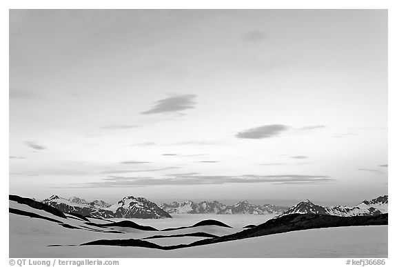 Pastel sky, mountain ranges and sea of clouds at dusk. Kenai Fjords National Park (black and white)