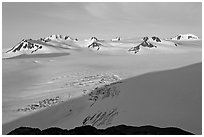 Snow-covered glacier and Harding Ice field peaks, sunrise. Kenai Fjords National Park ( black and white)