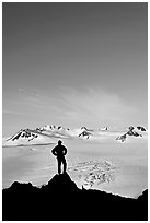 Hiker standing on overlook above Harding icefield. Kenai Fjords National Park ( black and white)