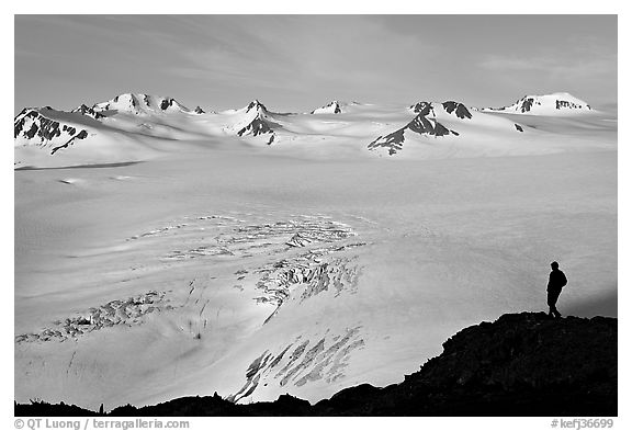 Harding icefield with man standing in the distance. Kenai Fjords National Park, Alaska, USA.
