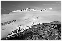Lichen-covered rocks and Harding ice field. Kenai Fjords National Park, Alaska, USA. (black and white)