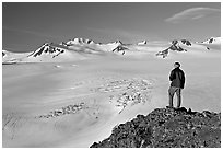 Man looking at the Harding ice field, early morning. Kenai Fjords National Park ( black and white)