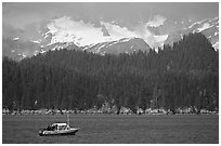 Small boat in Aialik Bay. Kenai Fjords National Park, Alaska, USA. (black and white)