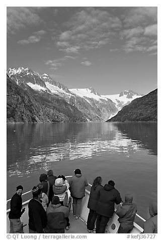 Mountains reflected in fjord, seen by tour boat passengers, Northwestern Fjord. Kenai Fjords National Park (black and white)
