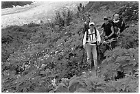 Women carrying infants on trail. Kenai Fjords National Park ( black and white)
