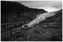 Sign indicating location of Exit Glacier in 2010. Kenai Fjords National Park ( black and white)