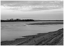 Low sandy shore of Kobuk River at dusk. Kobuk Valley National Park ( black and white)