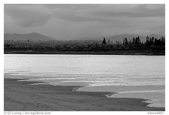 Sand bar shore, bright river and Baird mountains, evening. Kobuk Valley National Park (black and white)
