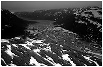 Aerial view of Tikakila River valley under dark clouds. Lake Clark National Park ( black and white)
