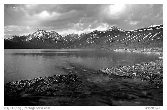 Stream flowing into Turquoise Lake, sunset. Lake Clark National Park (black and white)