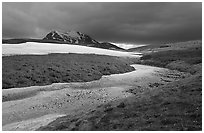 Snow nevesand mountains under dark storm clouds. Lake Clark National Park ( black and white)