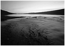 Stream flows into Turquoise Lake, midnight sunset. Lake Clark National Park ( black and white)