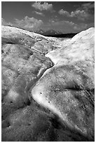 Ice, glacial creek on Root glacier, and mountains. Wrangell-St Elias National Park ( black and white)