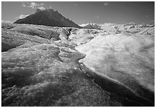 Stream running on surface of Root Glacier and Mt Donoho. Wrangell-St Elias National Park ( black and white)