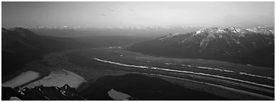 Elevated view of glacier terminal section and mountains. Wrangell-St Elias National Park (Panoramic black and white)