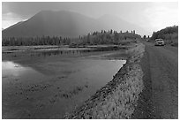 McCarthy Road and lake during afternoon storm. Wrangell-St Elias National Park, Alaska, USA. (black and white)
