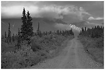 Nabena road at sunset with last light on mountains. Wrangell-St Elias National Park ( black and white)