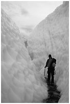Hiker in narrow canyon, Root glacier. Wrangell-St Elias National Park ( black and white)