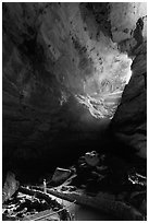Visitor looking at natural entrance from below. Carlsbad Caverns National Park, New Mexico, USA. (black and white)