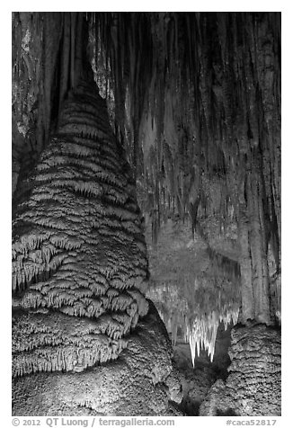 Stalagmite and flowstone framing chandelier. Carlsbad Caverns National Park (black and white)