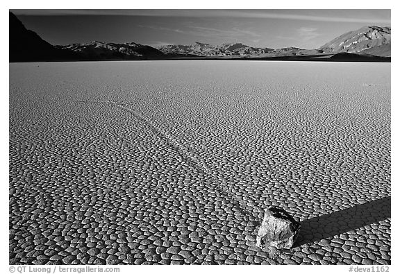 Tracks, moving rock on the Racetrack, late afternoon. Death Valley National Park (black and white)
