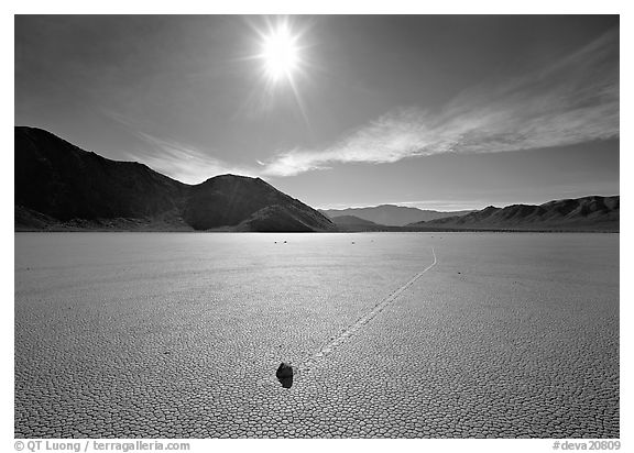 Sun and sliding rock on the Racetrack, mid-day. Death Valley National Park (black and white)