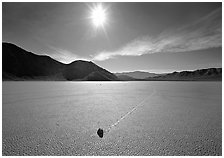 Sun and sliding rock on the Racetrack, mid-day. Death Valley National Park ( black and white)