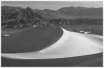 Mesquite Sand dunes and Amargosa Range, early morning. Death Valley National Park, California, USA. (black and white)