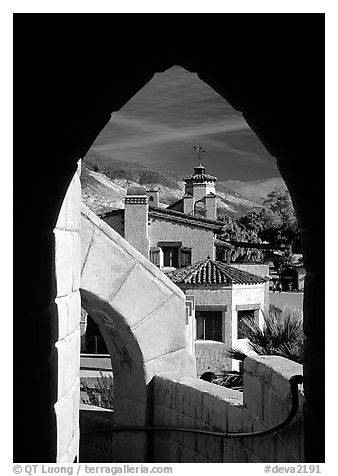 Arch framing Scotty's Castle. Death Valley National Park (black and white)