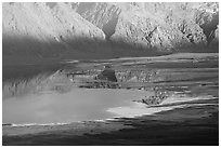Reflections in Manly Lake at Badwater, seen from Aguereberry point, late afternoon. Death Valley National Park, California, USA. (black and white)
