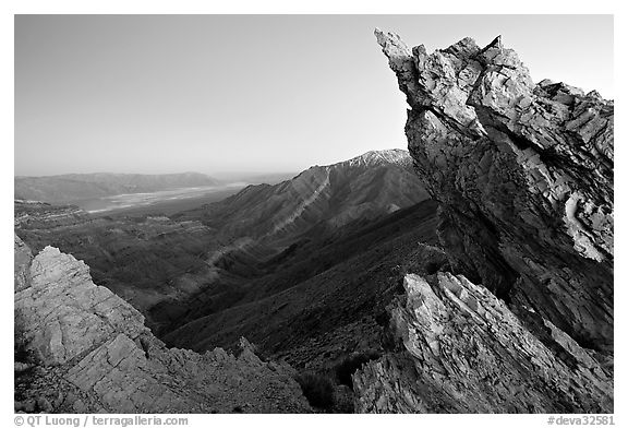 Rocks framing the Death Valley view from Aguereberry point, dusk. Death Valley National Park (black and white)