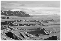 Eroded hills and salt pan from Aguereberry point, early morning. Death Valley National Park ( black and white)