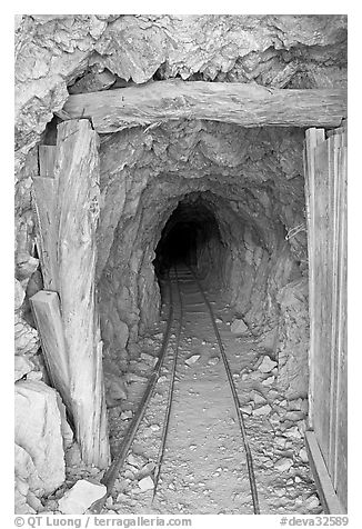 Entrance to a abandoned gallery of Cashier mine, morning. Death Valley National Park (black and white)