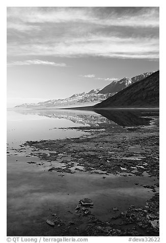Black mountain reflections in flooded Badwater basin, early morning. Death Valley National Park (black and white)