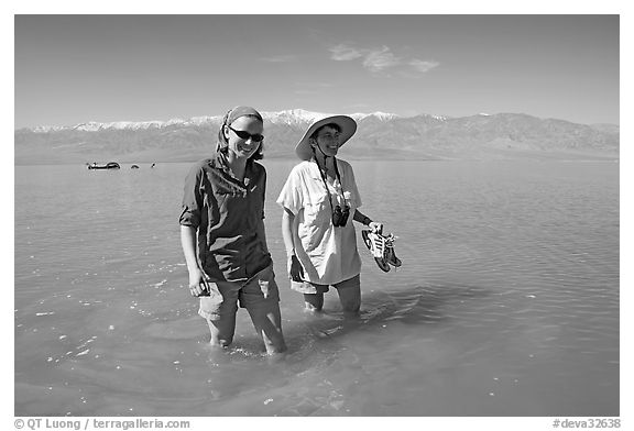Women wading in the knee-deep seasonal lake. Death Valley National Park (black and white)