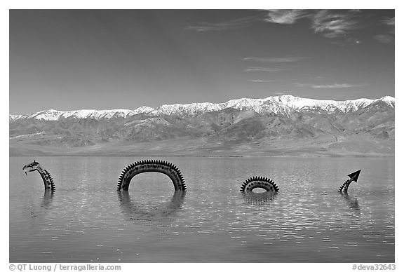 Dragon art installation in Manly Lake and Panamint range. Death Valley National Park (black and white)
