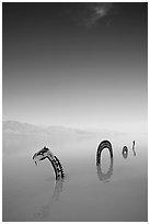 Short lived dragon art installation in rare seasonal lake. Death Valley National Park, California, USA. (black and white)