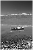 Salt formations, kayaker, and Panamint range. Death Valley National Park ( black and white)
