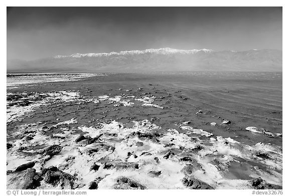 Salt formations and Manly Lake, morning. Death Valley National Park (black and white)