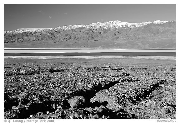 Valley with seasonal lake in the distance and Panamint Range, morning. Death Valley National Park (black and white)