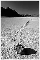 Sailing rock and travel groove on the Racetrack. Death Valley National Park ( black and white)