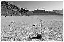 Moving rocks and non-linear tracks, the Racetrack. Death Valley National Park ( black and white)