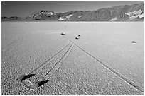 Sailing stones, the Racetrack playa. Death Valley National Park ( black and white)