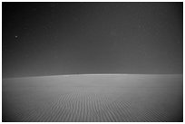 Dune ripples and starry sky. Death Valley National Park ( black and white)
