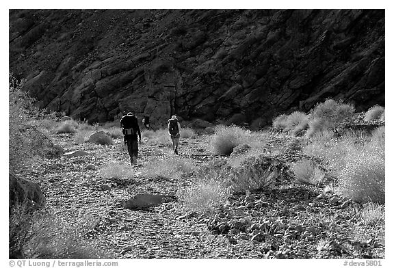 Hikers in a side canyon. Death Valley National Park, California, USA.