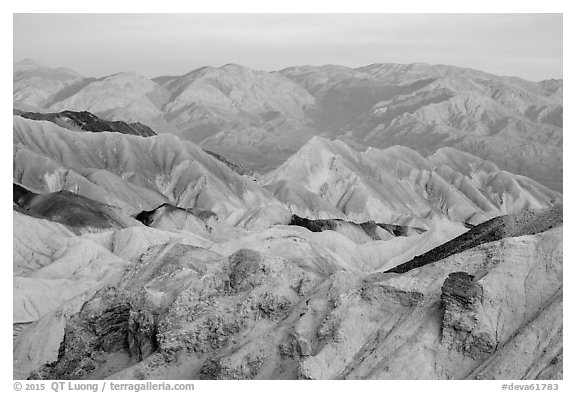 Badlands and mountains at sunrise, Twenty Mule Team Canyon. Death Valley National Park (black and white)