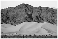 Ibex Dunes and Saddle Peak Hills at sunset. Death Valley National Park ( black and white)